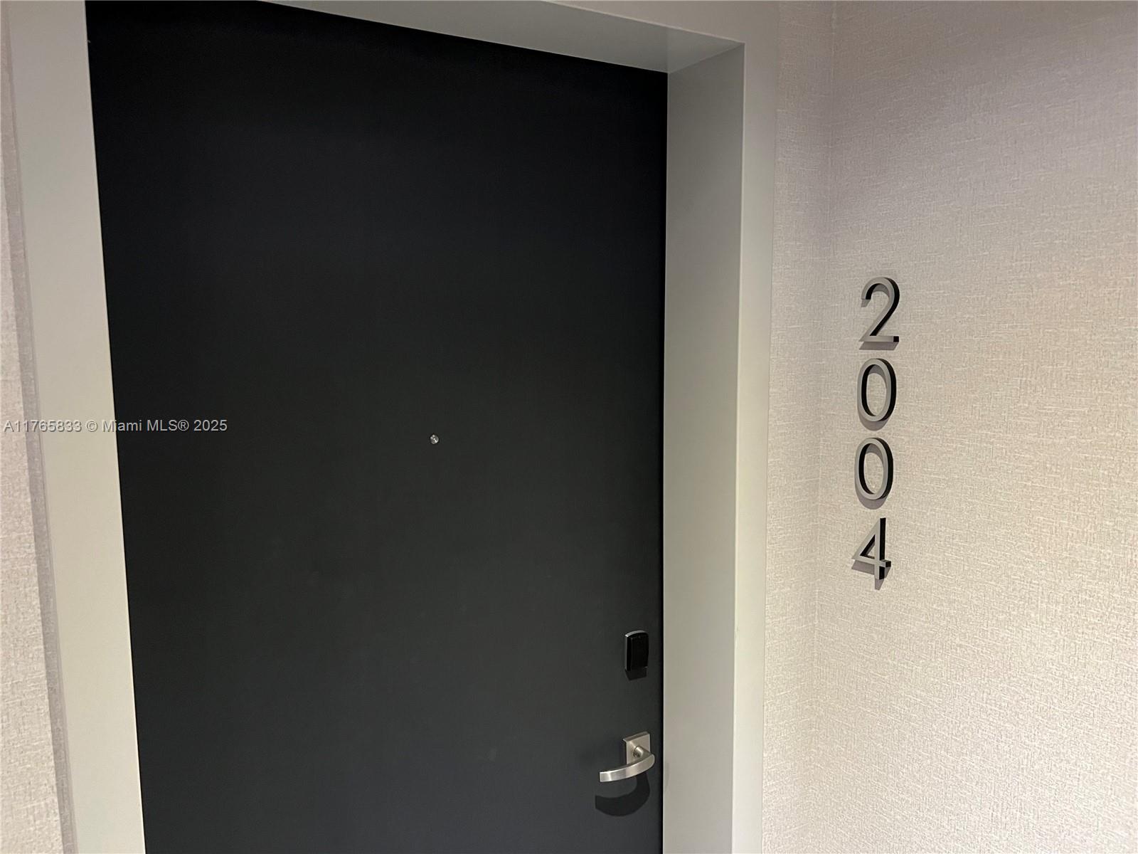 1451 Brickell Avenue, Unit 2004 Miami, FL 33131 - Photo 2 of 41 a bathroom with a shower