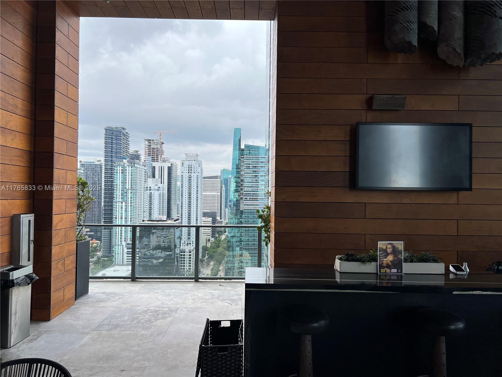 1451 Brickell Avenue, Unit 2004 Miami, FL 33131 - Photo 33 of 41 a bathroom with a sink and a mirror