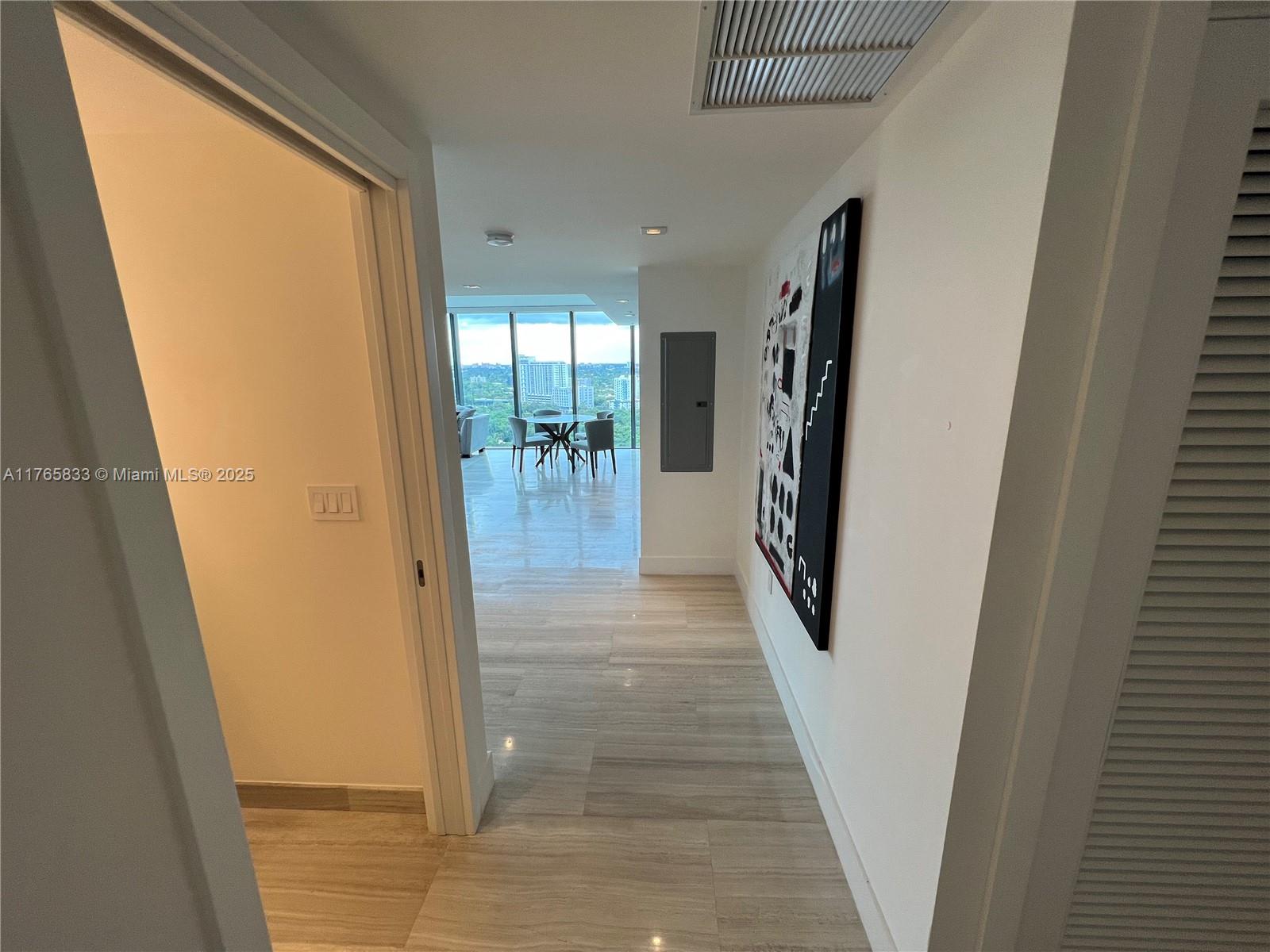 1451 Brickell Avenue, Unit 2004 Miami, FL 33131 - Photo 5 of 41 a view of entryway and hall with wooden floor