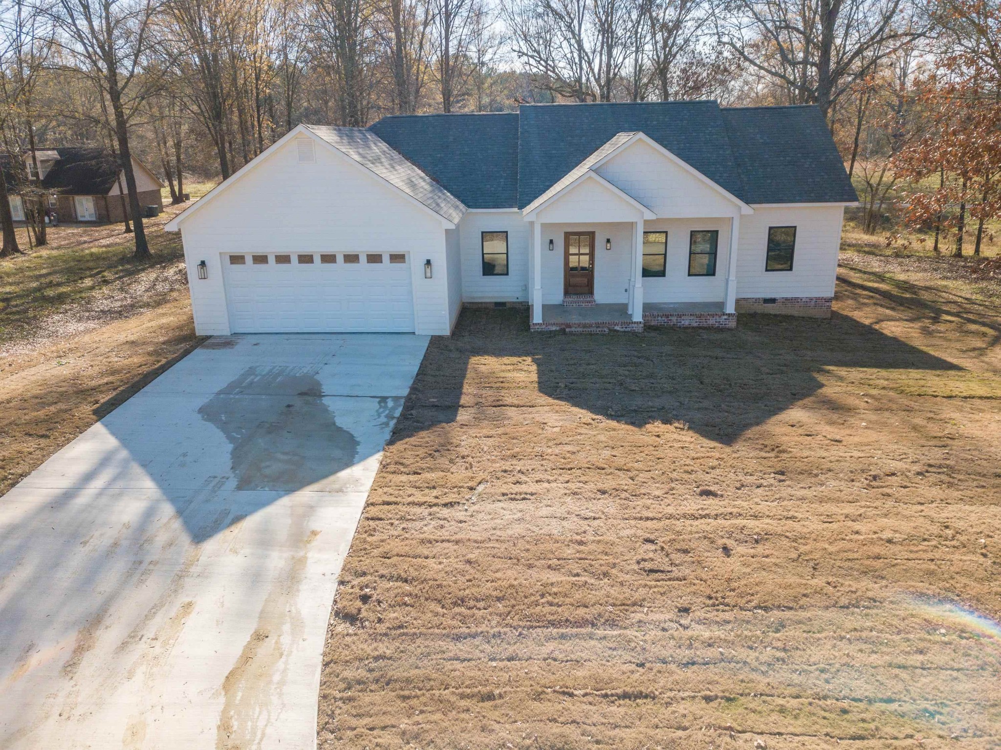 113 Braxton Lane Corinth, MS 38834 - Photo 2 of 39 a front view of a house with a yard