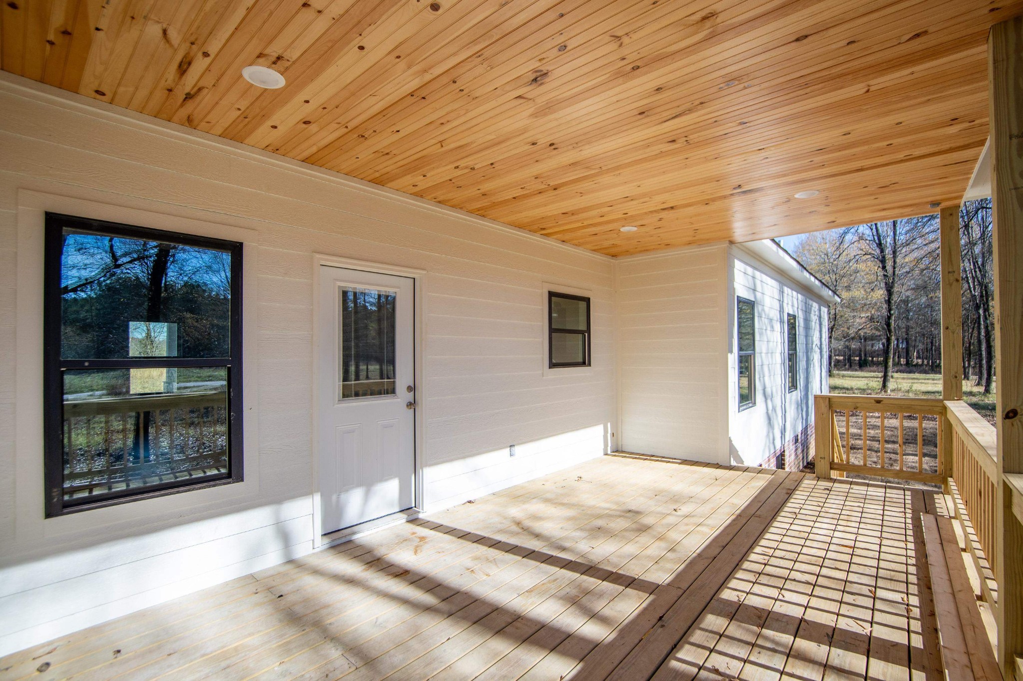 113 Braxton Lane Corinth, MS 38834 - Photo 35 of 39 a bedroom with a bed and wooden floor