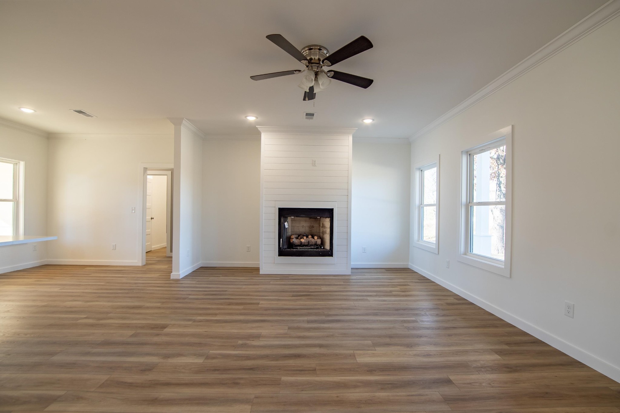 113 Braxton Lane Corinth, MS 38834 - Photo 9 of 39 an empty room with windows and ceiling fan