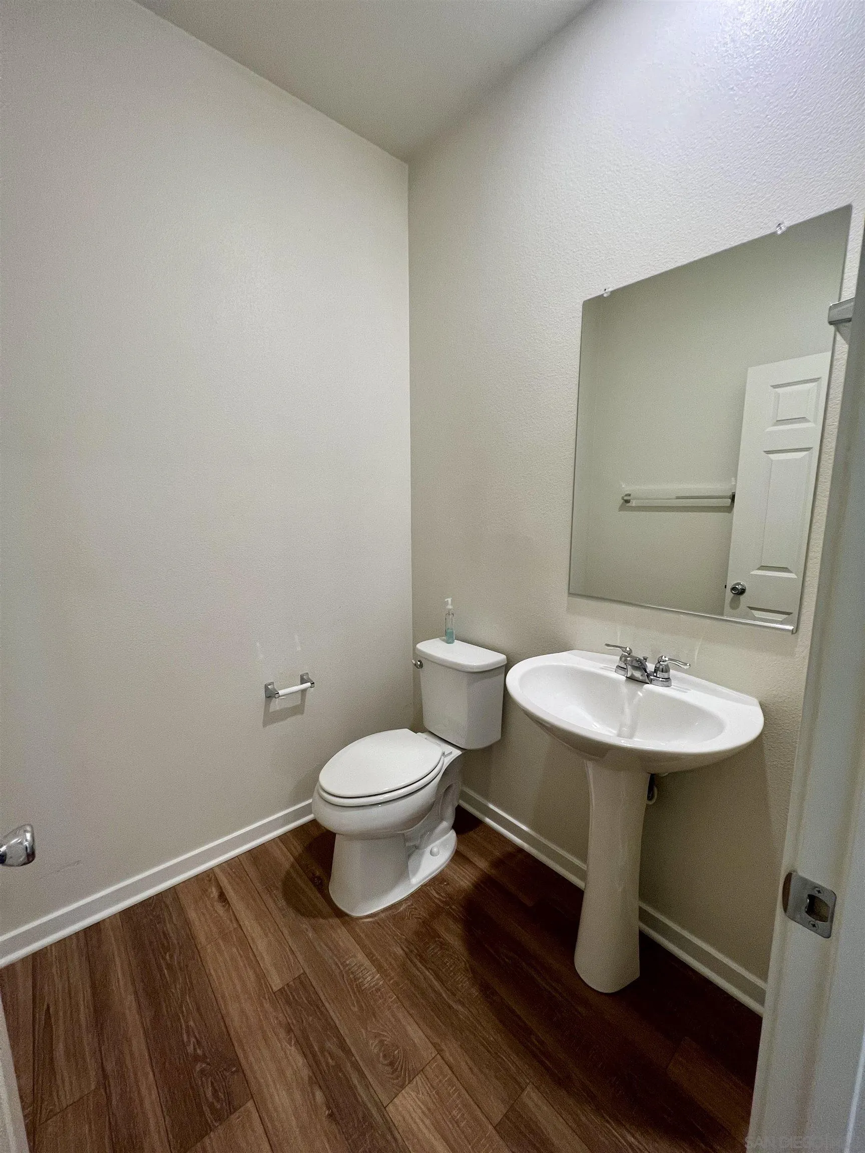 415 Mission Villas Road San Marcos, CA 92069 - Photo 12 of 23 a bathroom with a toilet a sink and mirror