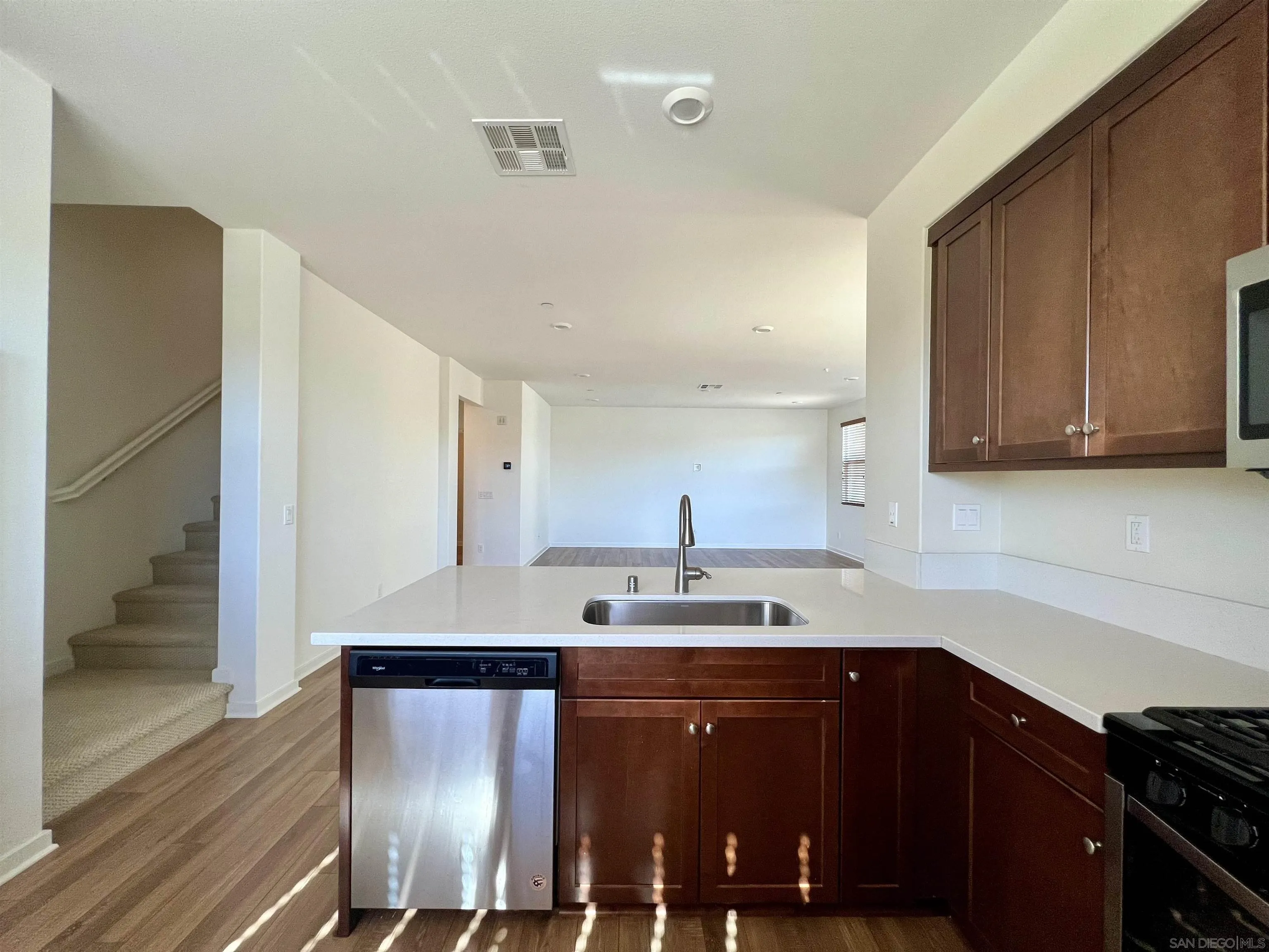 415 Mission Villas Road San Marcos, CA 92069 - Photo 14 of 23 a kitchen with a sink cabinets and wooden floor