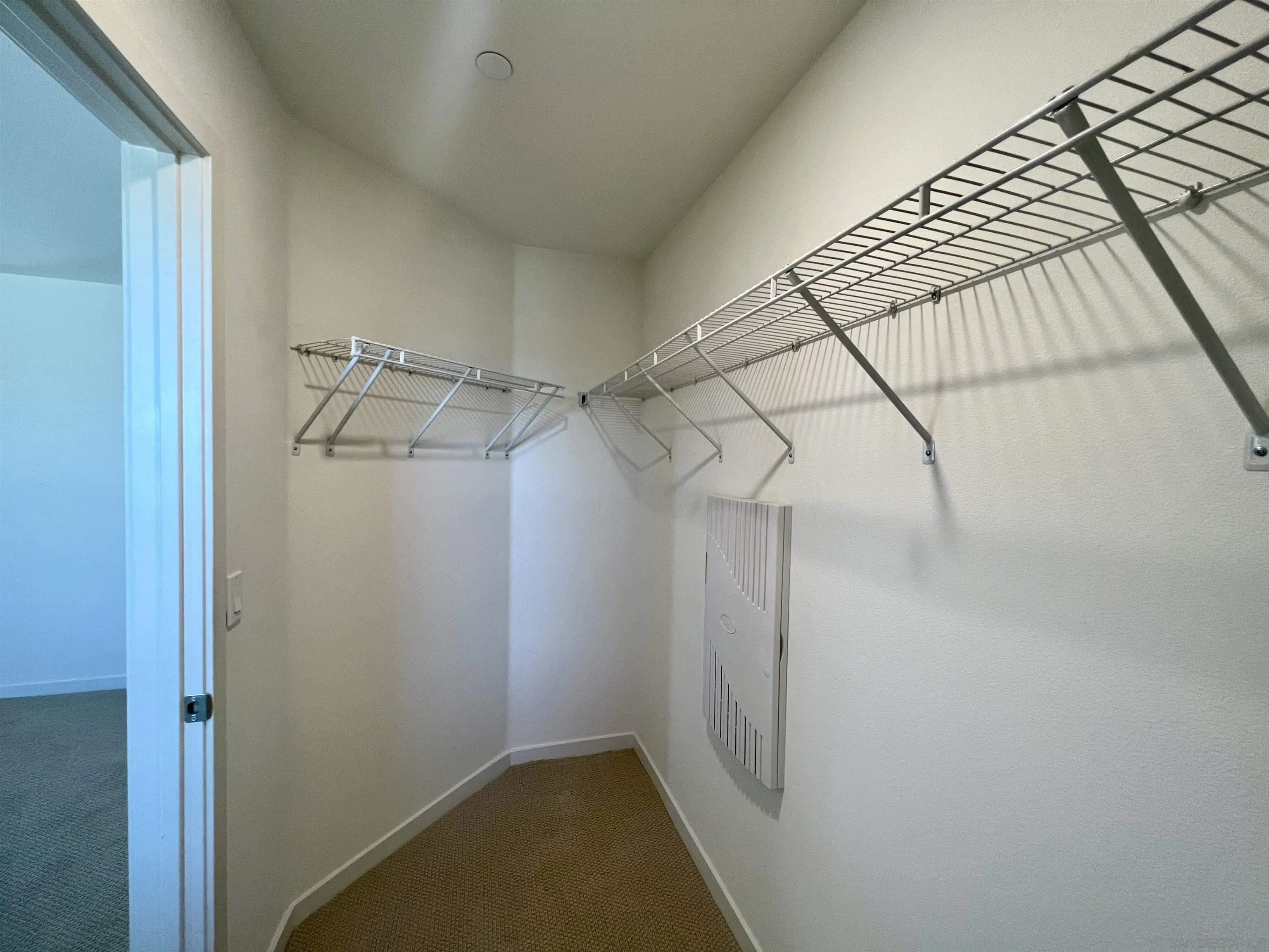 415 Mission Villas Road San Marcos, CA 92069 - Photo 18 of 23 a view of a room with racks on the wall