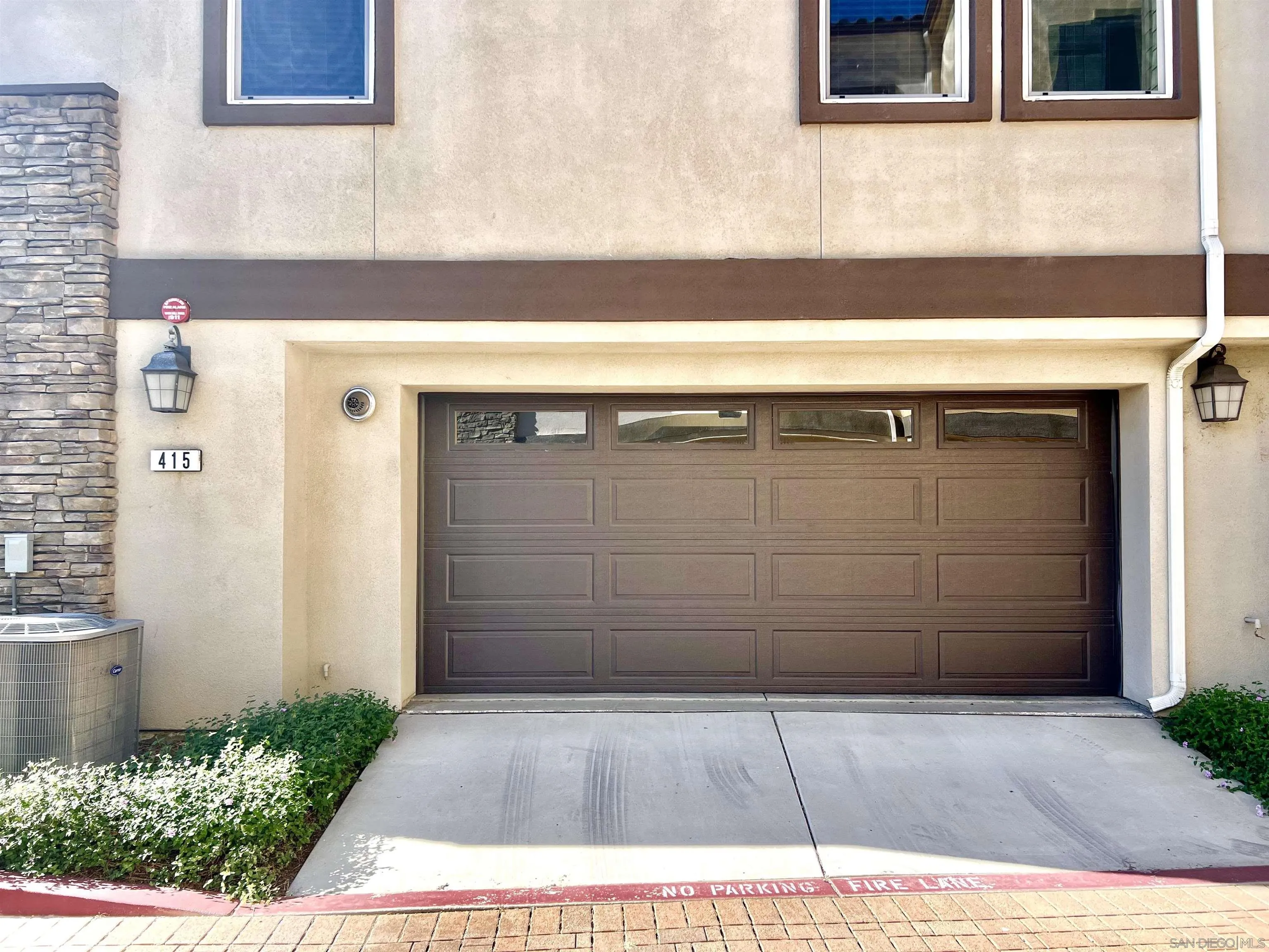 415 Mission Villas Road San Marcos, CA 92069 - Photo 2 of 23 a view of a brick house with a door and a wooden floor