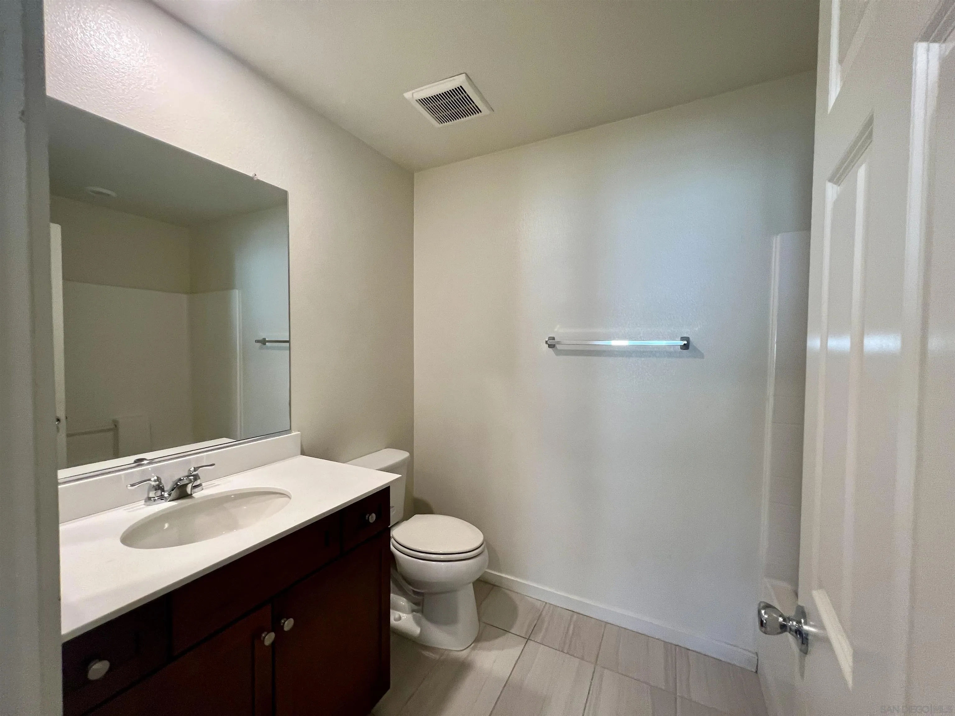415 Mission Villas Road San Marcos, CA 92069 - Photo 21 of 23 a bathroom with a sink toilet and vanity