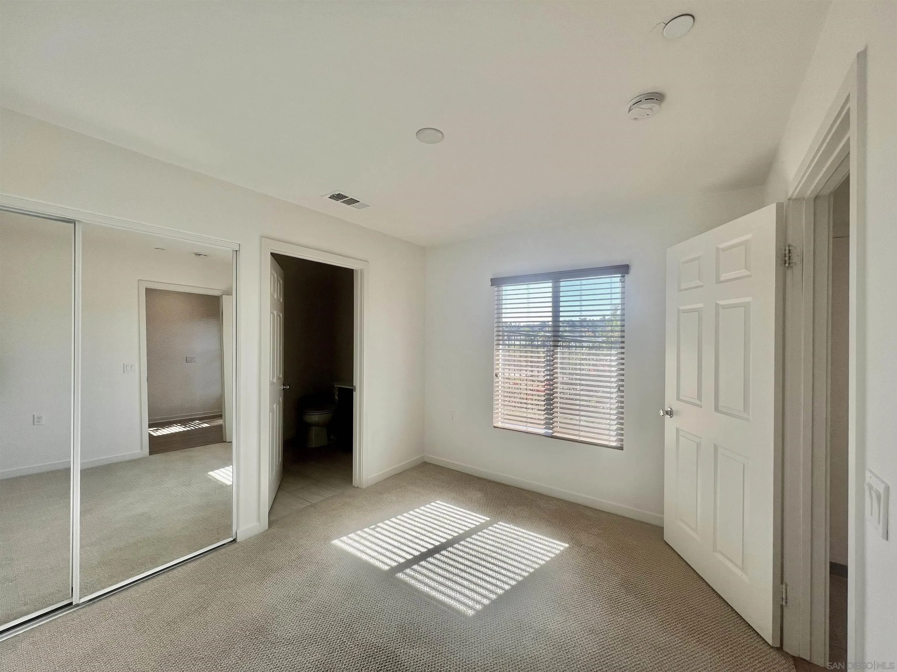415 Mission Villas Road San Marcos, CA 92069 - Photo 6 of 23 a view of an empty room with a window