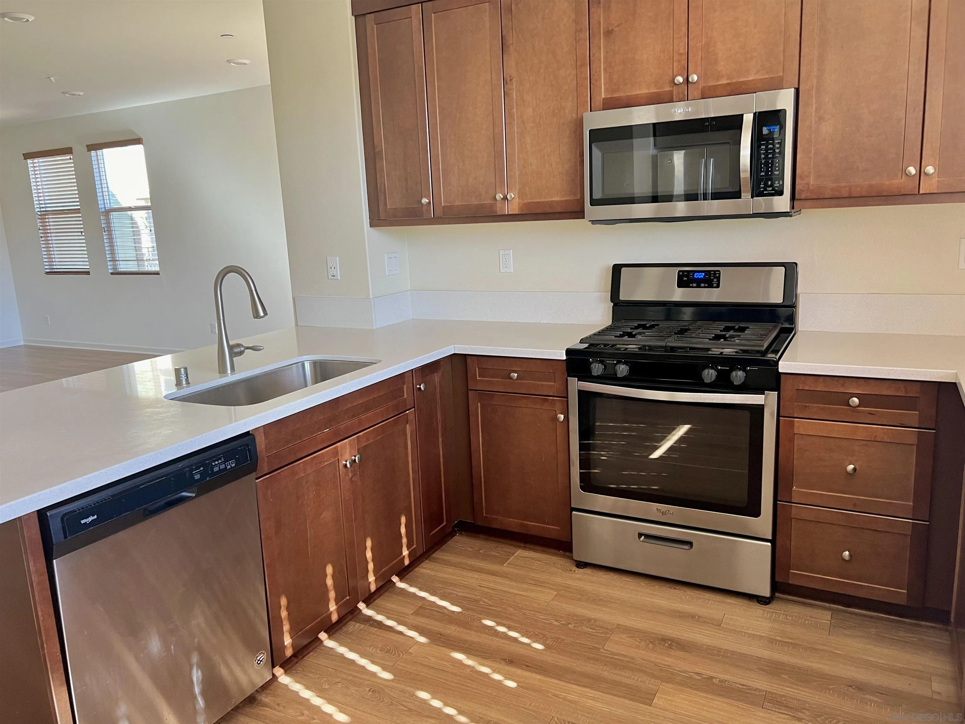 415 Mission Villas Road San Marcos, CA 92069 - Photo 10 of 23 a kitchen with stainless steel appliances granite countertop a stove a microwave and a sink