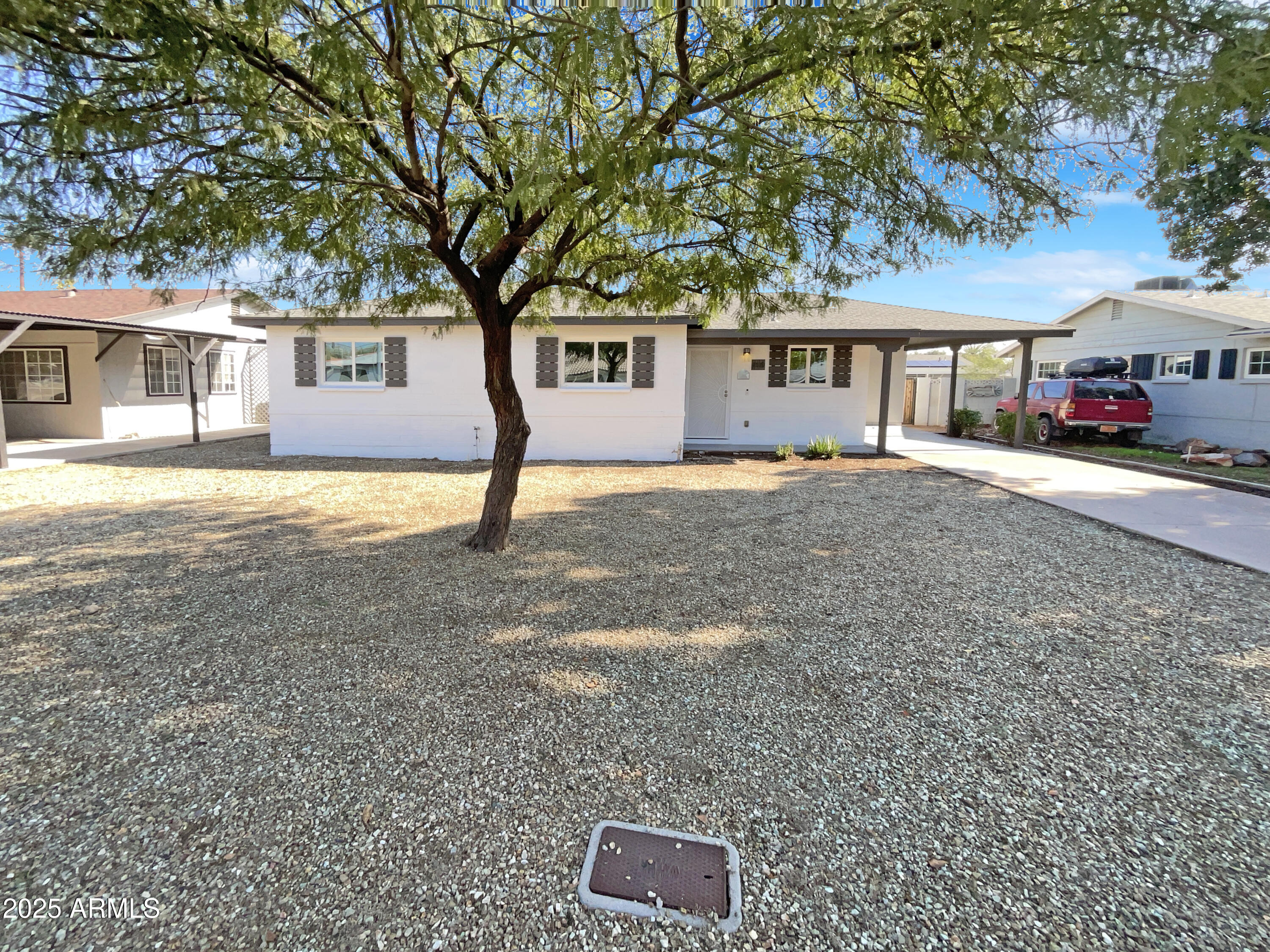 7231 North 23rd Avenue Phoenix, AZ 85021 - Photo 1 of 28 a front view of a house with a yard