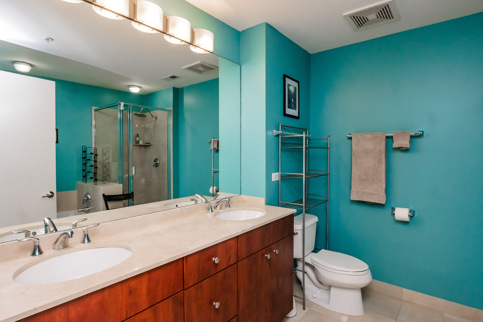 565 West Quincy Street, Unit 710 Chicago, IL 60661 - Photo 18 of 22 a bathroom with a sink and a mirror