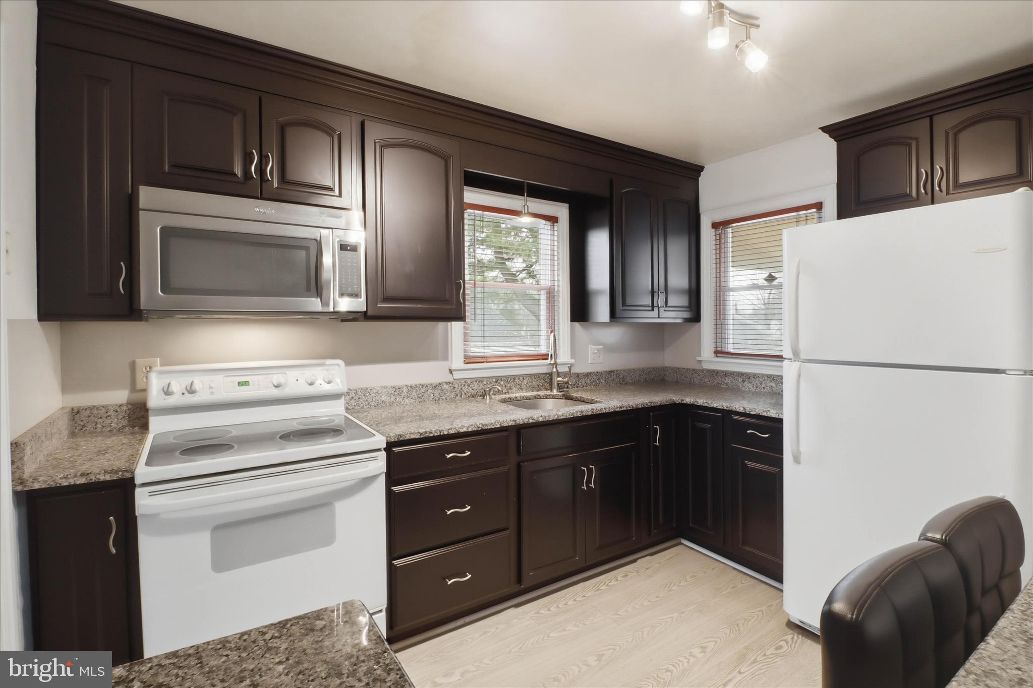 931 Rolridge Avenue Lancaster, PA 17603 - Photo 11 of 52 a kitchen with a stove microwave and refrigerator