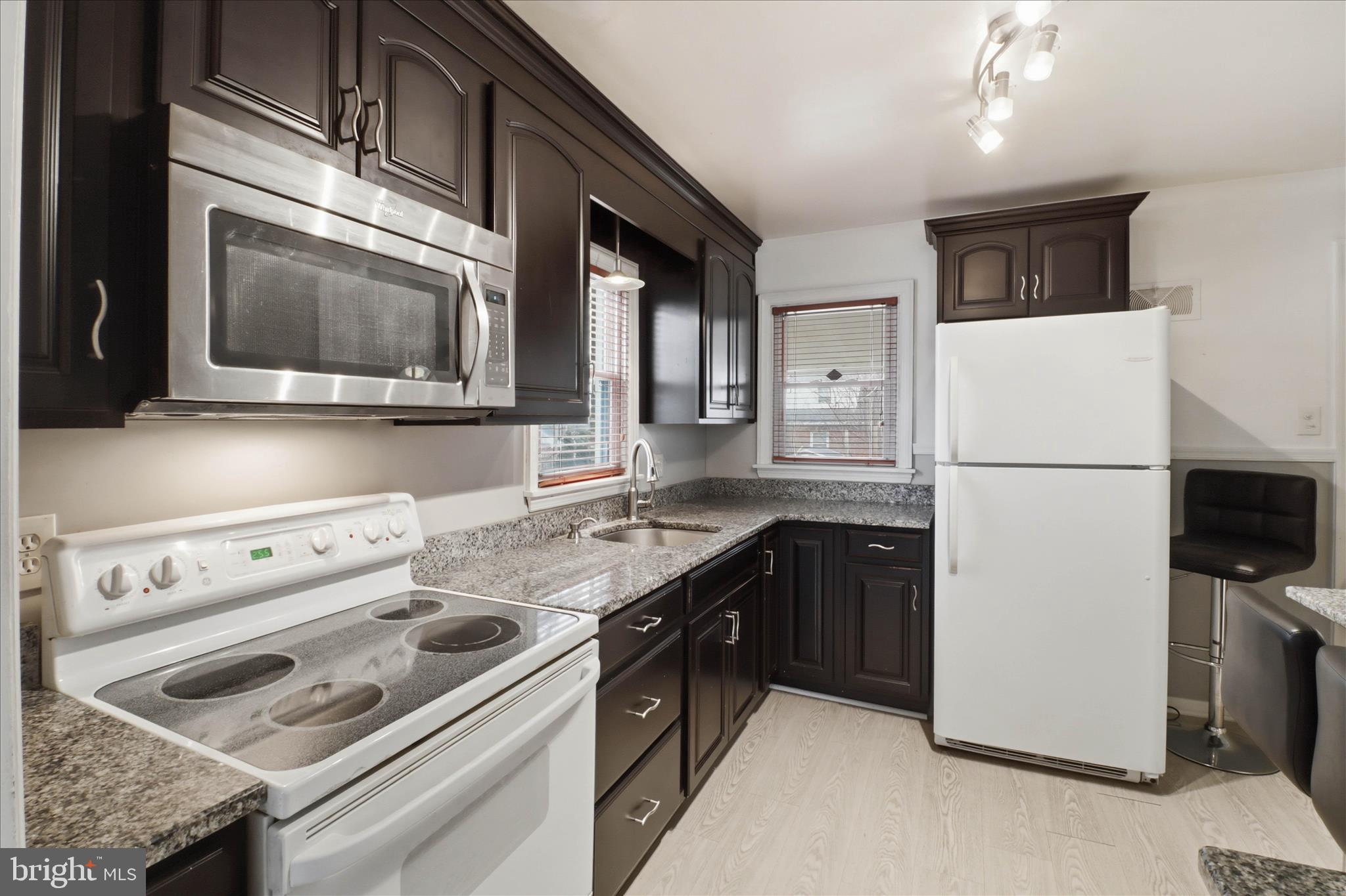 931 Rolridge Avenue Lancaster, PA 17603 - Photo 12 of 52 a kitchen with a stove microwave and refrigerator