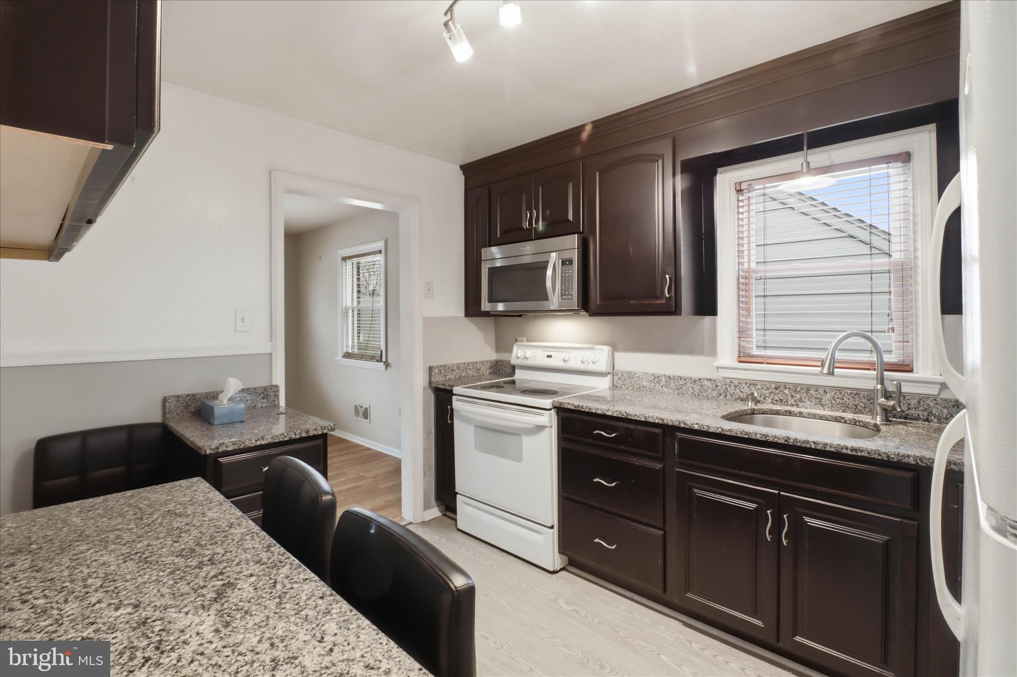 931 Rolridge Avenue Lancaster, PA 17603 - Photo 13 of 52 a kitchen with stainless steel appliances granite countertop a sink stove and refrigerator
