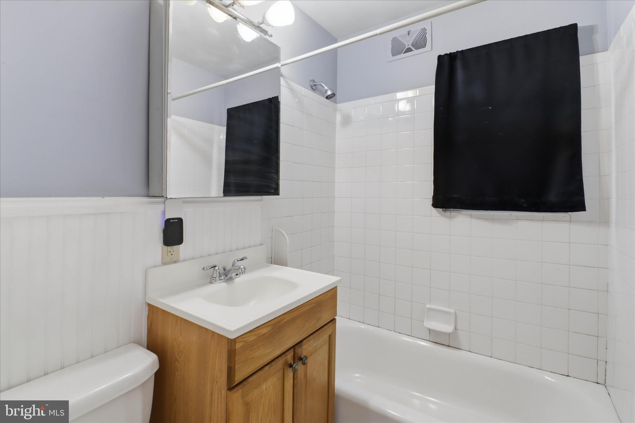 931 Rolridge Avenue Lancaster, PA 17603 - Photo 17 of 52 a bathroom with a sink toilet a mirror and shower