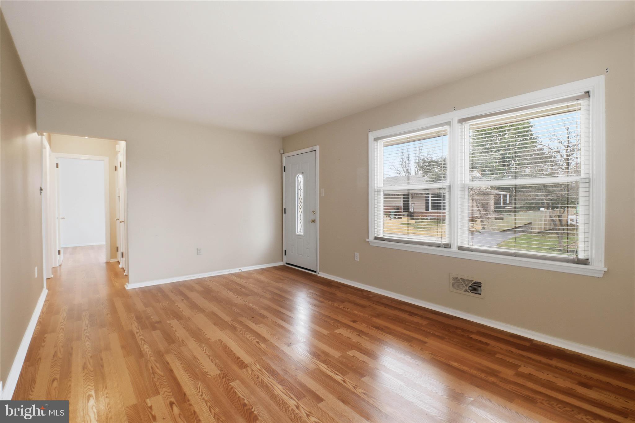 931 Rolridge Avenue Lancaster, PA 17603 - Photo 9 of 52 a view of an empty room with wooden floor and a window