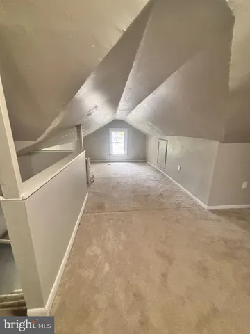 a view of a big room with closet and windows