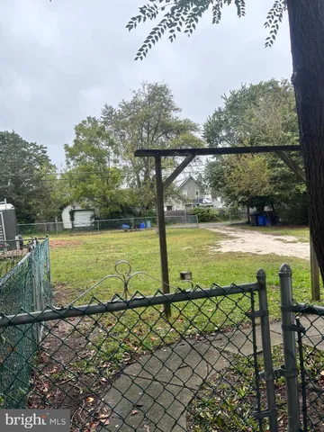 a view of a swimming pool with a yard