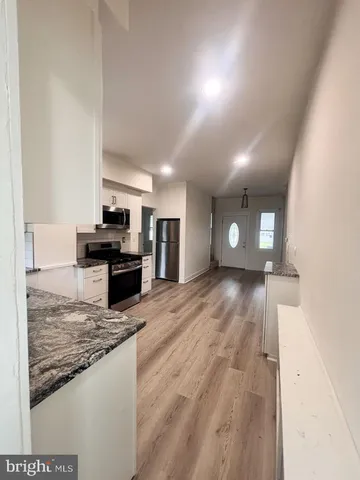 a view of a kitchen with a sink