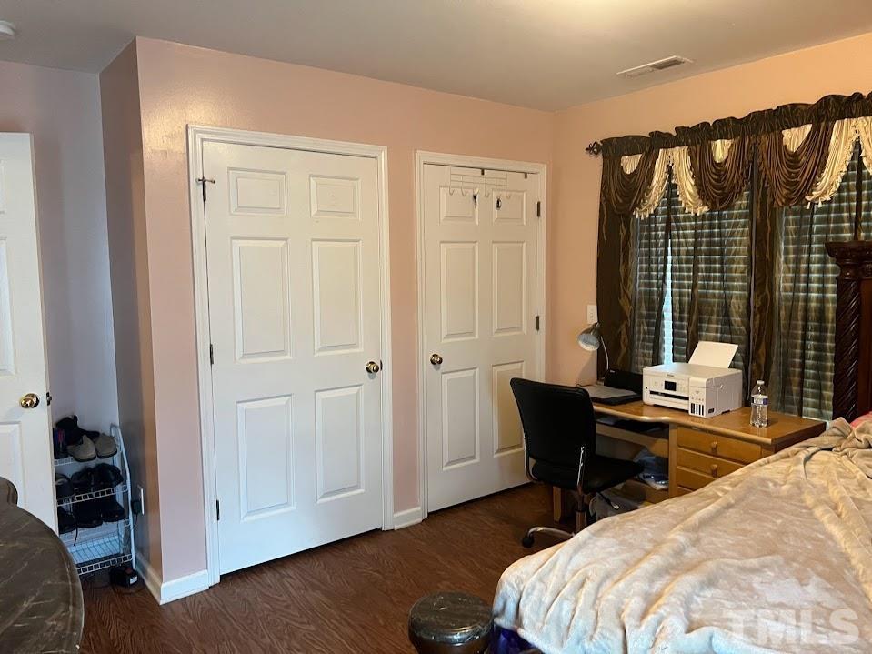 4030 Green Jacket Trail Raleigh, NC 27610 - Photo 3 of 21 a bedroom with a bed and a table in it