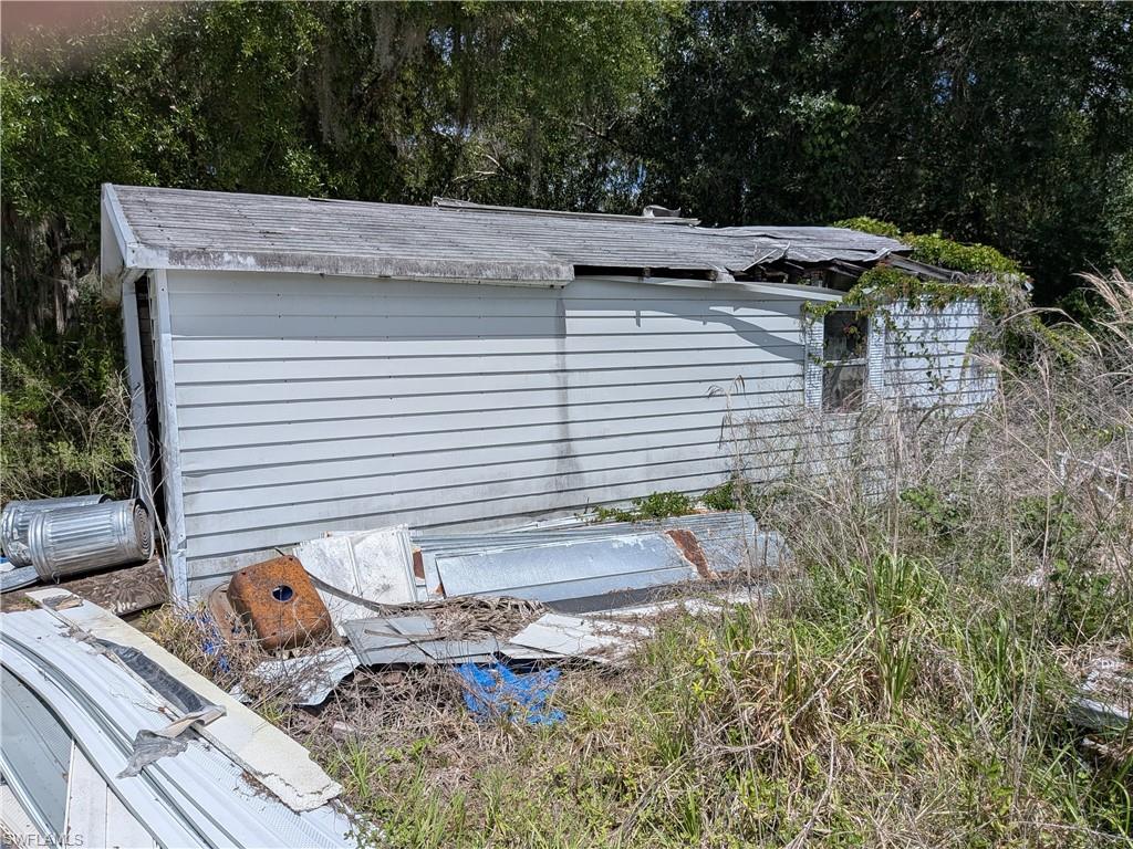 17191 Frank Road Alva, FL 33920 - Photo 20 of 27 a view of a backyard with chairs