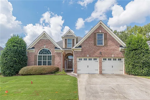 a front view of a house with a yard