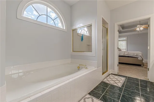 a kitchen with stainless steel appliances granite countertop a sink a stove and cabinets