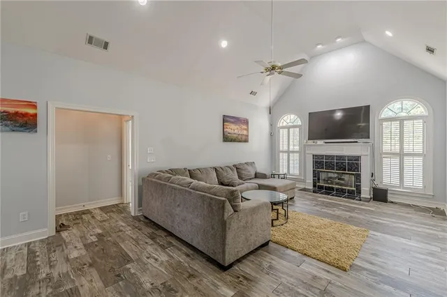 a kitchen with granite countertop a refrigerator stove and sink