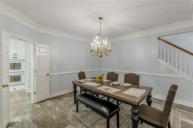 a kitchen with stainless steel appliances a refrigerator and a stove top oven