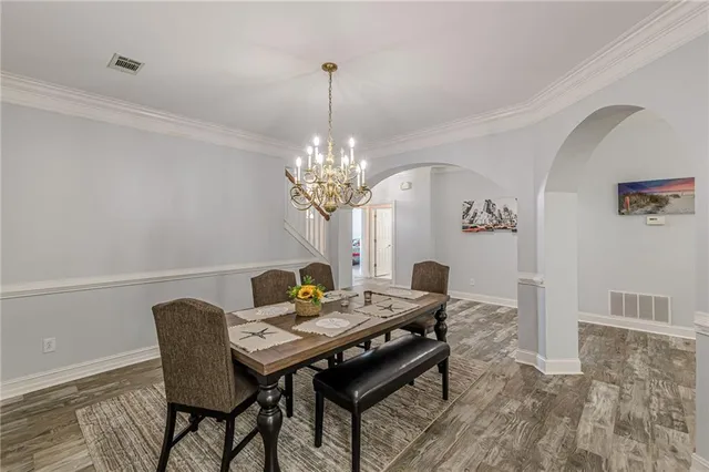a bathroom with a double vanity sink mirror double shower and a toilet