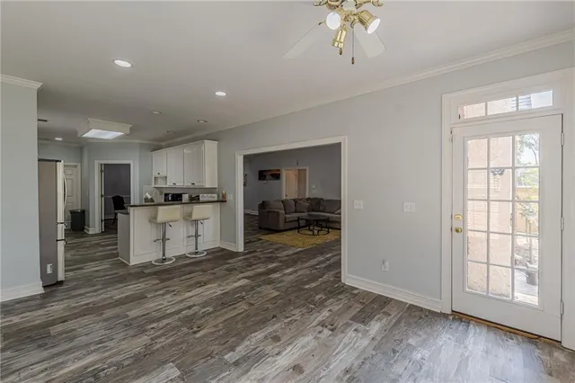 a living room with a bed furniture and a window