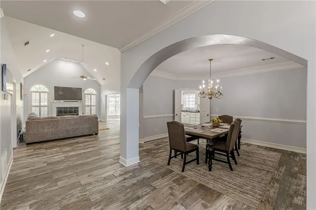 a living room with furniture flowerpot and window