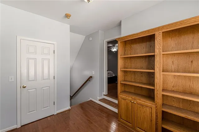 a white toilet sitting next to a bathroom sink and a shower