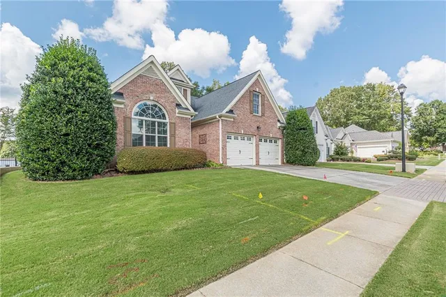 a front view of a house with a yard