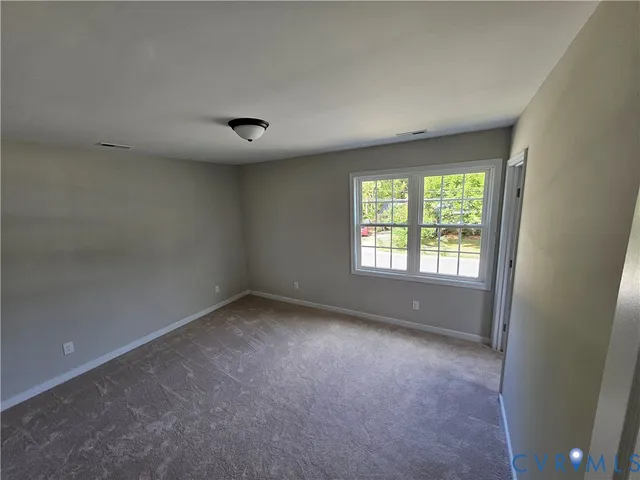 a view of a hallway with a window
