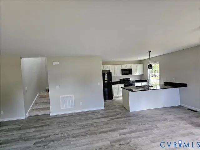 a kitchen with stainless steel appliances a refrigerator and a stove
