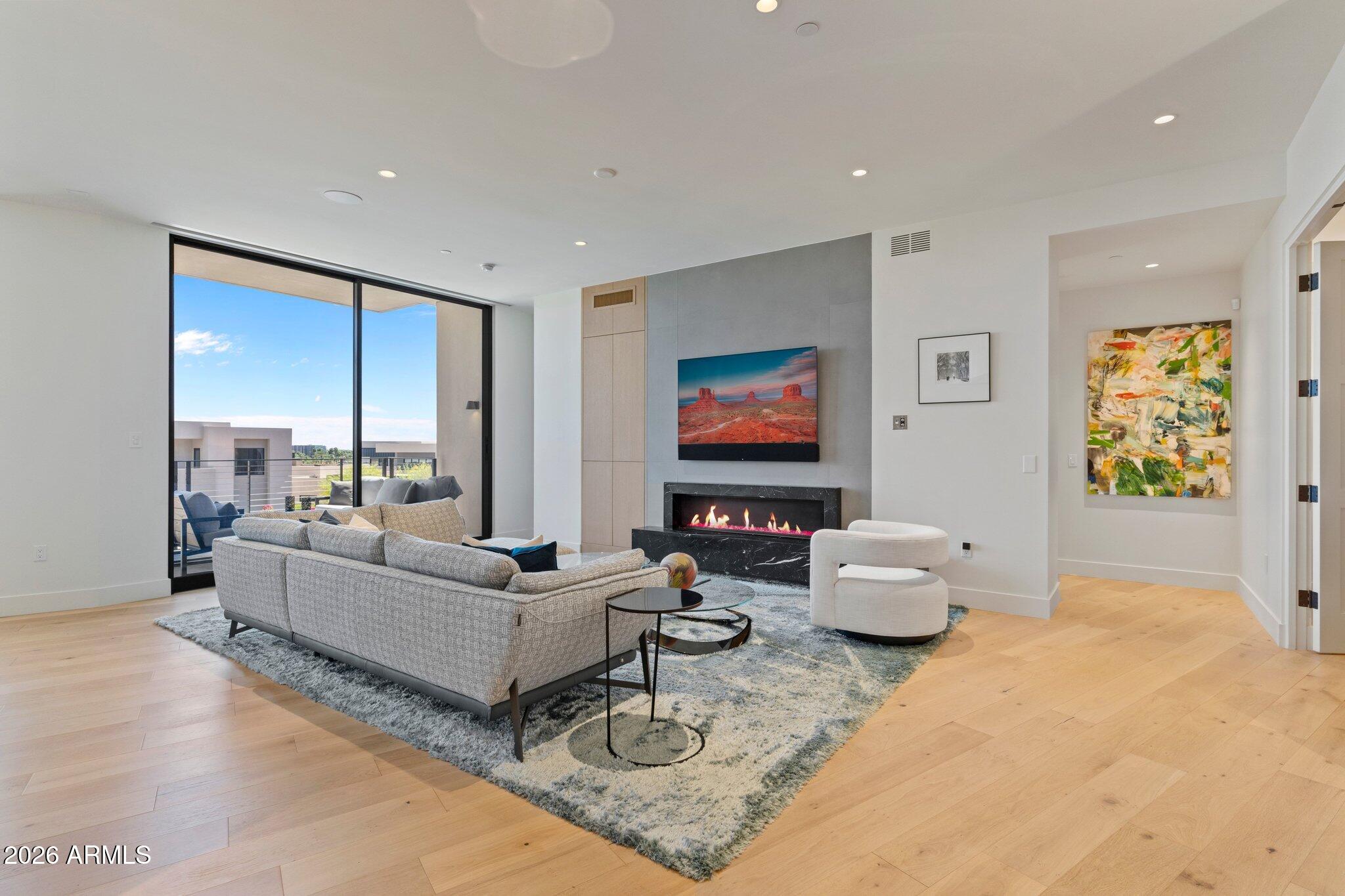 5000 North Camelback Ridge Drive, Unit 208 Scottsdale, AZ 85251 - Photo 10 of 53 a living room with furniture and a flat screen tv