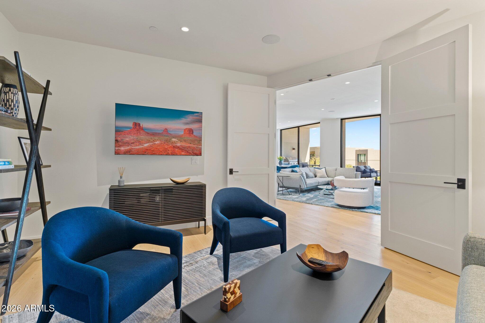 5000 North Camelback Ridge Drive, Unit 208 Scottsdale, AZ 85251 - Photo 19 of 53 a living room with furniture and a wooden floor