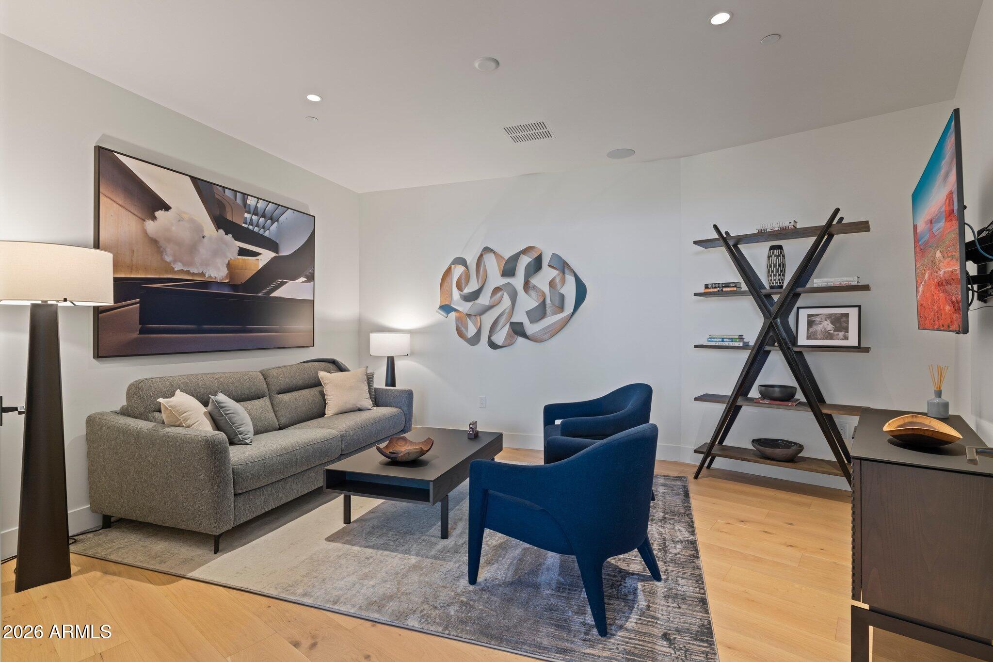 5000 North Camelback Ridge Drive, Unit 208 Scottsdale, AZ 85251 - Photo 20 of 53 a living room with furniture a rug and a wall painting