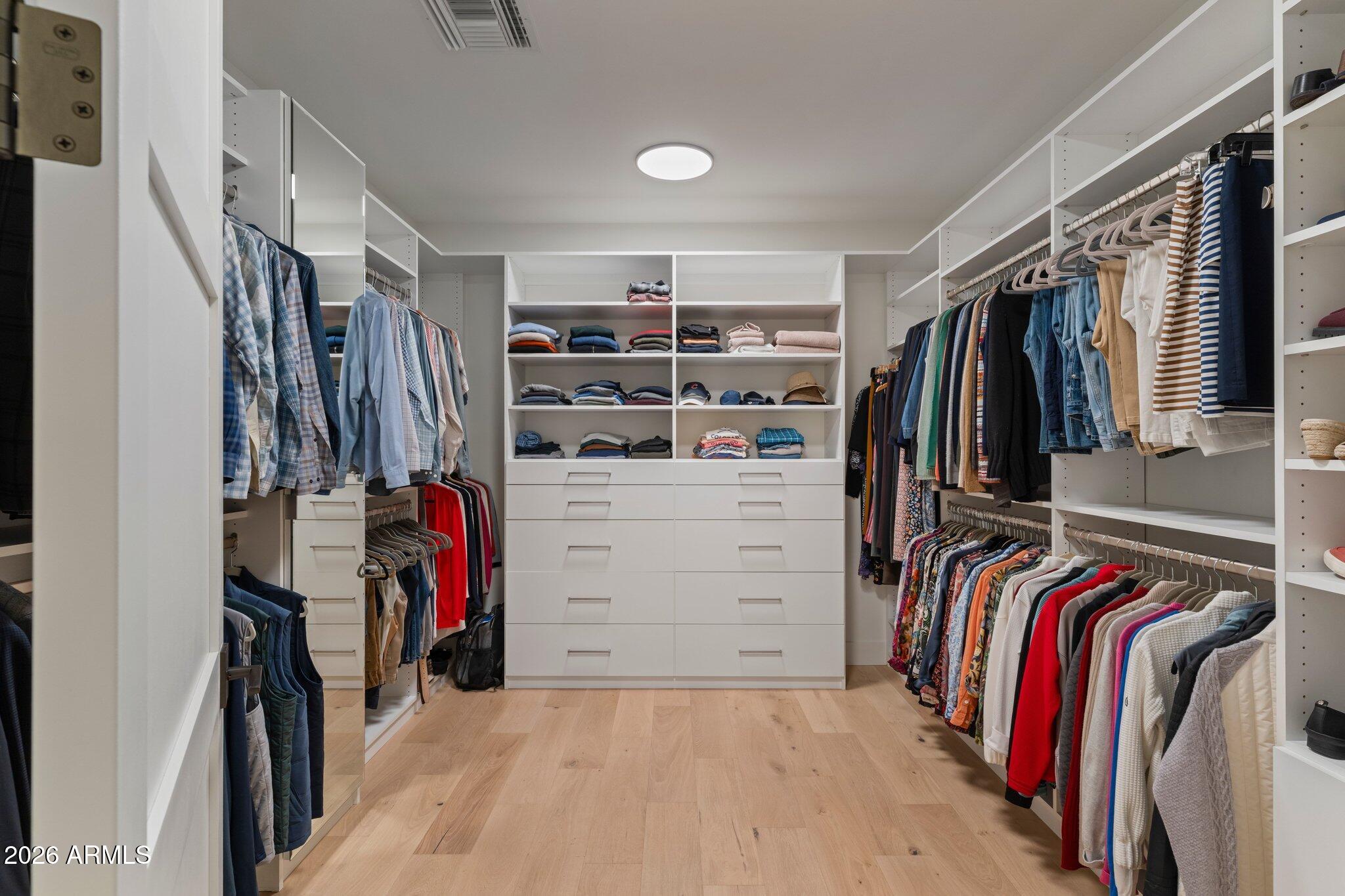 5000 North Camelback Ridge Drive, Unit 208 Scottsdale, AZ 85251 - Photo 29 of 53 a view of walk in closet with clothes