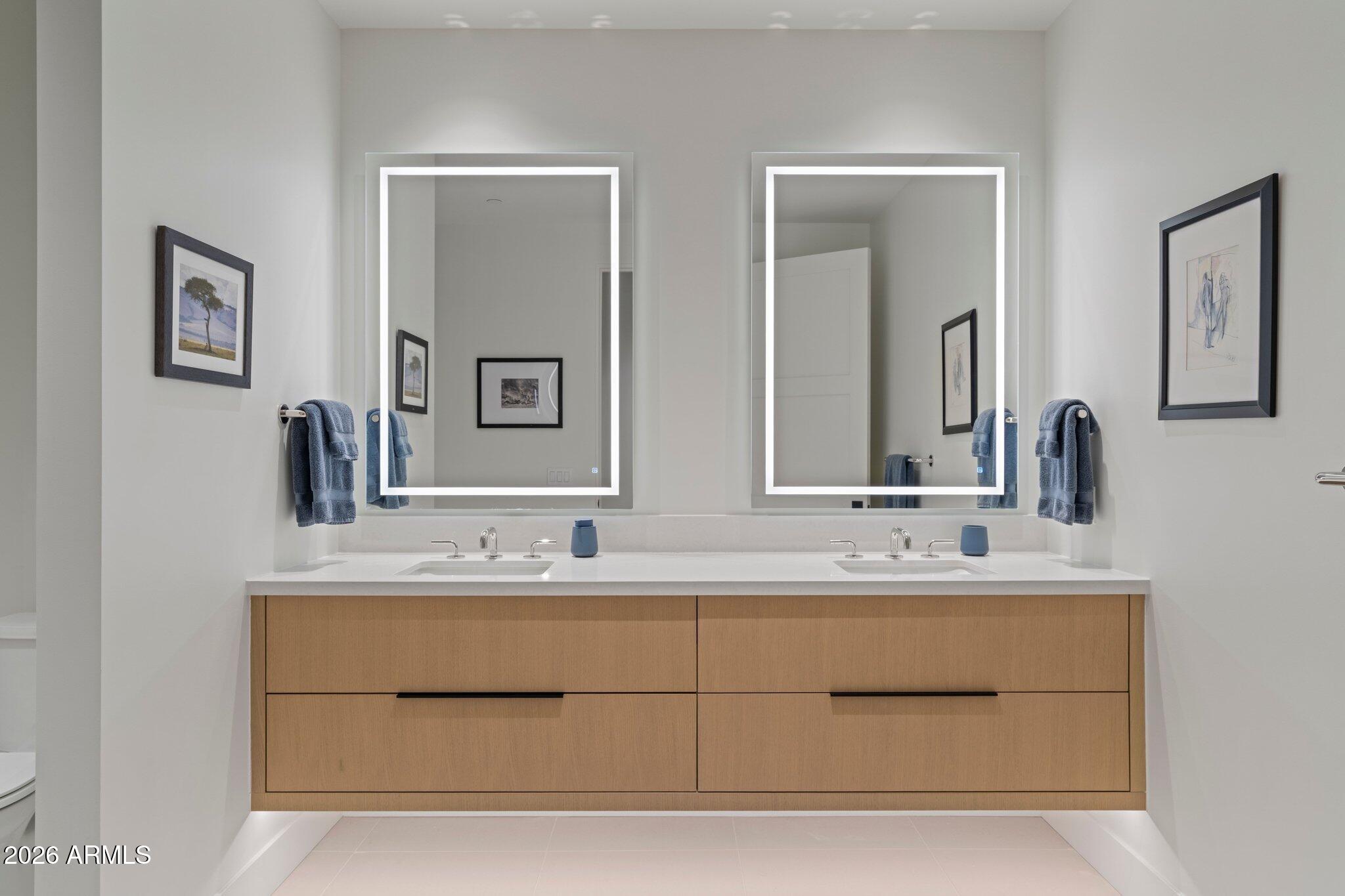 5000 North Camelback Ridge Drive, Unit 208 Scottsdale, AZ 85251 - Photo 32 of 53 a bathroom with a double vanity sink mirror and