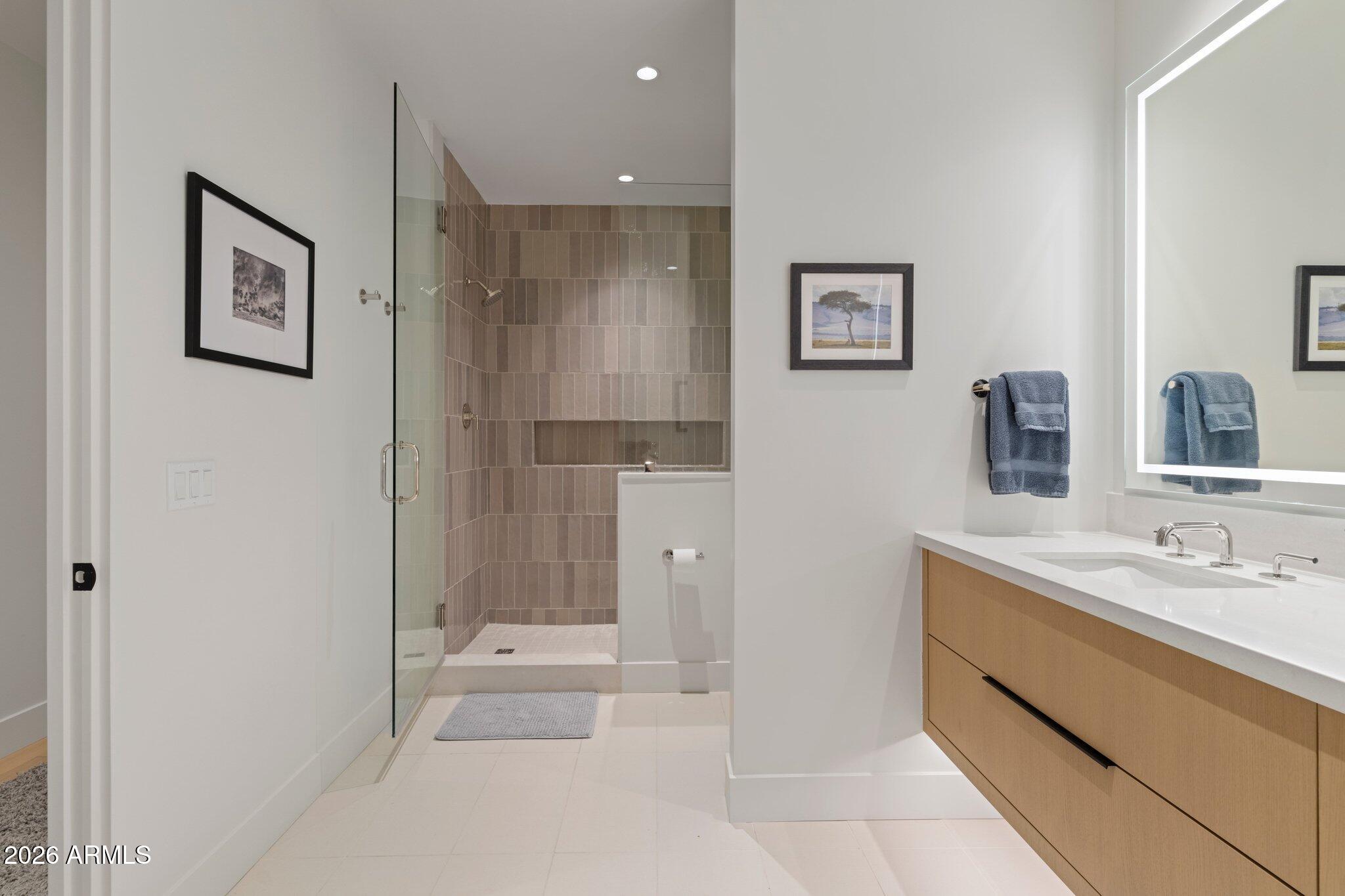 5000 North Camelback Ridge Drive, Unit 208 Scottsdale, AZ 85251 - Photo 33 of 53 a bathroom with a bathtub sink and mirror