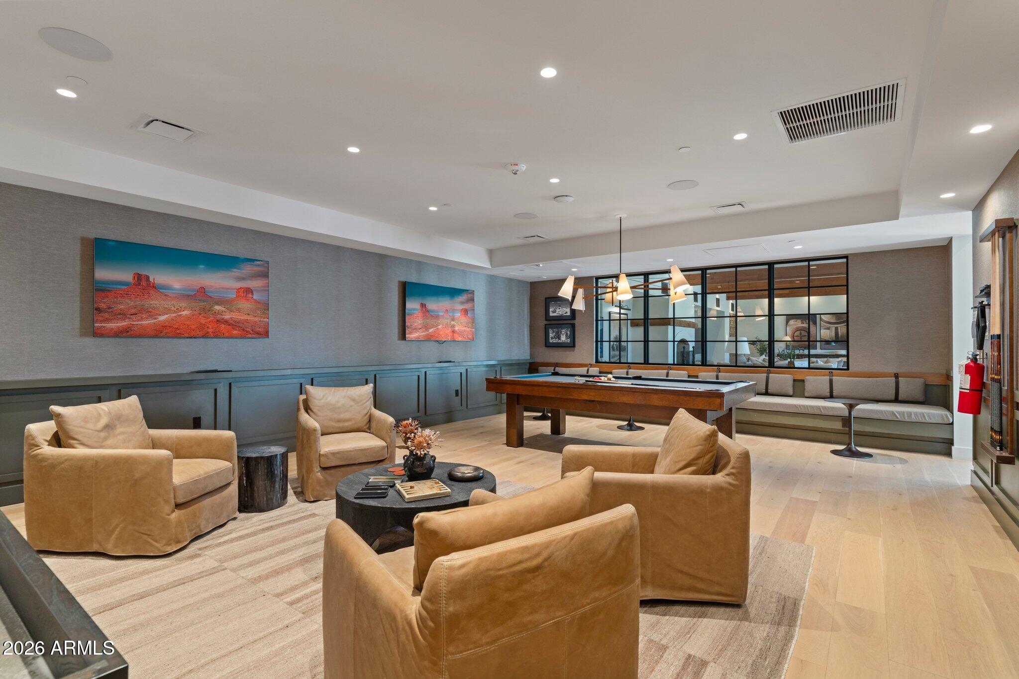 5000 North Camelback Ridge Drive, Unit 208 Scottsdale, AZ 85251 - Photo 41 of 53 a living room with furniture and a flat screen tv
