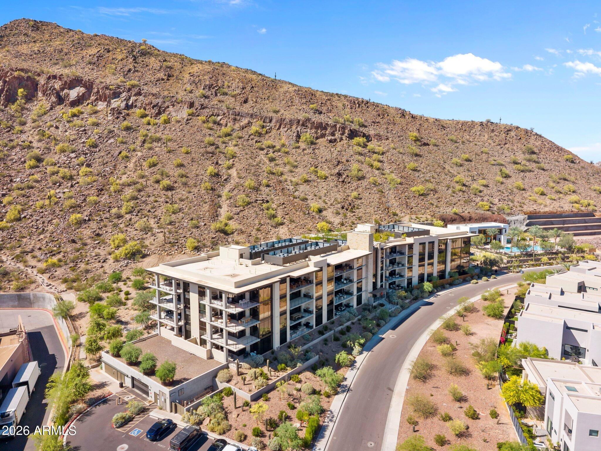 5000 North Camelback Ridge Drive, Unit 208 Scottsdale, AZ 85251 - Photo 50 of 53 a view of a large building with a mountain in the background