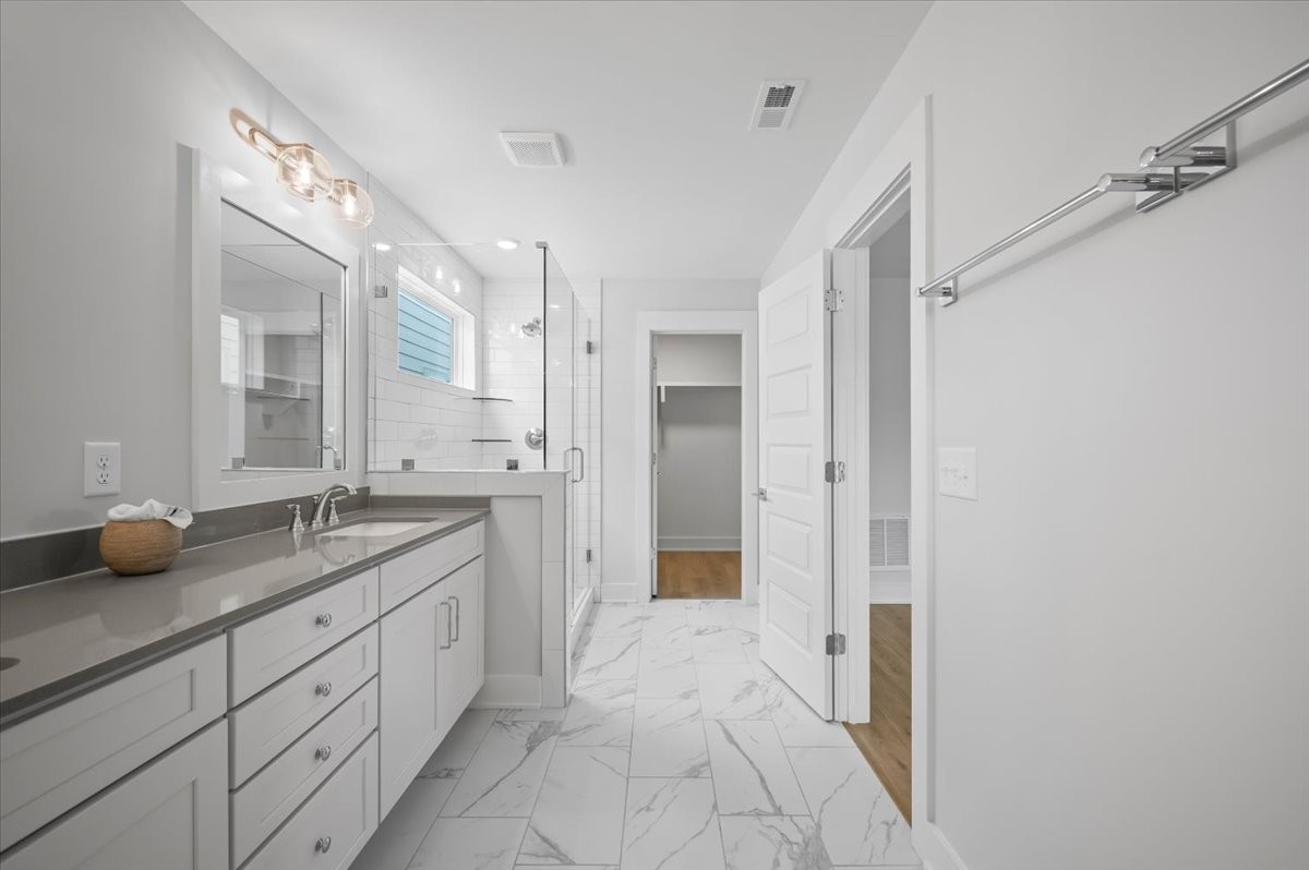 3045 B Hillside Road Nashville, TN 37207 - Photo 18 of 32 a spacious bathroom with a granite countertop sink mirror and shower
