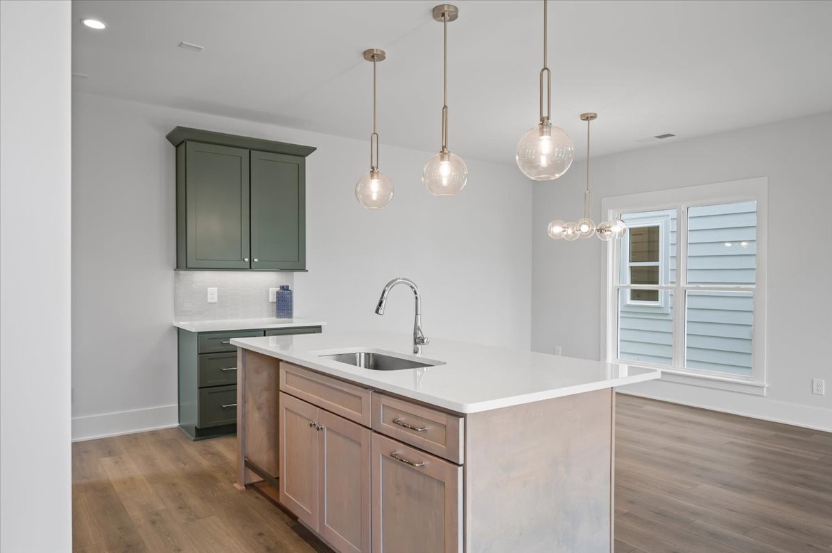 3045 B Hillside Road Nashville, TN 37207 - Photo 9 of 32 a kitchen with a sink and dishwasher with wooden floor