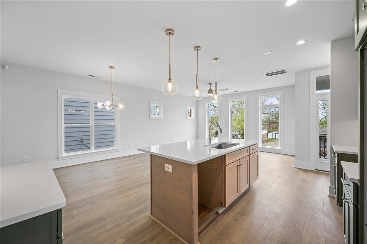 3045 B Hillside Road Nashville, TN 37207 - Photo 10 of 32 a large kitchen with stainless steel appliances granite countertop a stove and a wooden floors