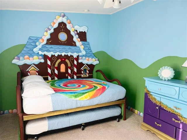 a bed that has a bed and a table in it