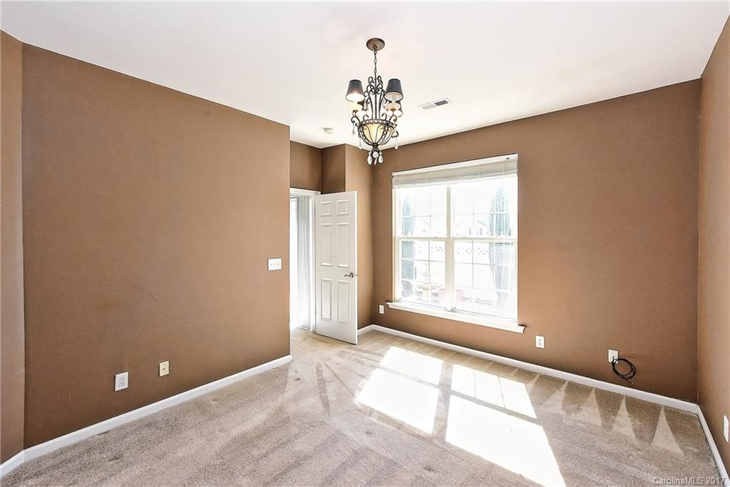 919 Azurine Circle, Unit 69 Fort Mill, SC 29708 - Photo 14 of 22 a view of an empty room with a window
