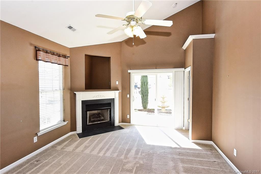 919 Azurine Circle, Unit 69 Fort Mill, SC 29708 - Photo 4 of 22 a view of an empty room with window and fire place